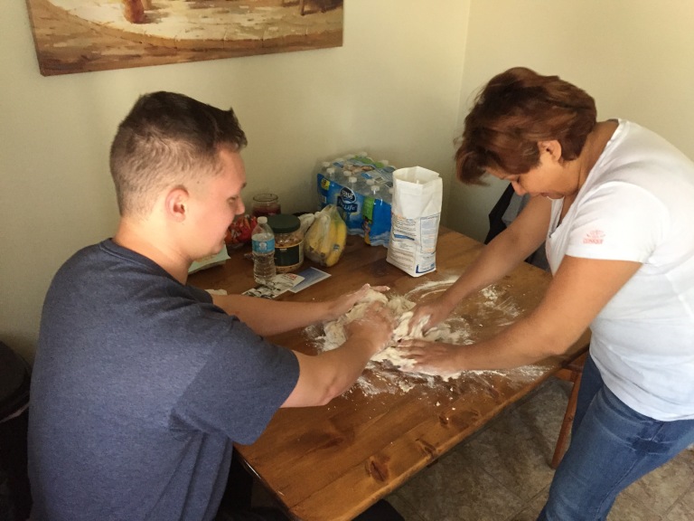 Kyle teaches his mother in law, Belkeys, how to make Papas bread.